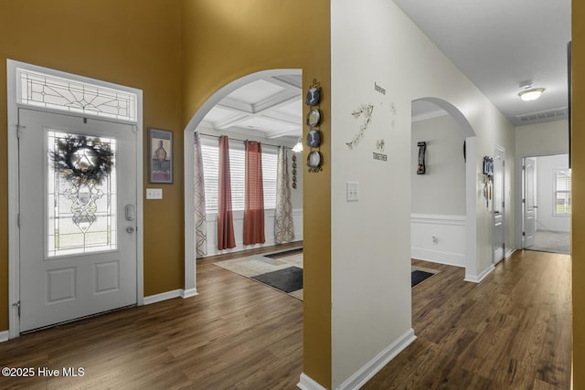 700 Stafford Ln, Jacksonville, NC 28546 - foyer with wood finished floors, arched walkways, coffered ceiling, baseboards, and beam ceiling