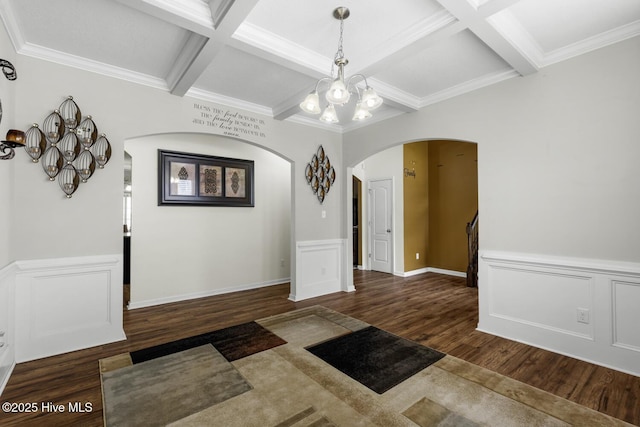 700 Stafford Ln, Jacksonville, NC 28546 - entrance foyer featuring arched walkways, wood finished floors, a chandelier, coffered ceiling, and beamed ceiling