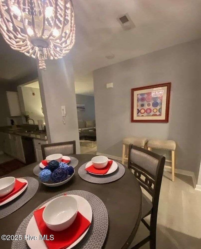 311 N 2nd St Unit B, Wilmington, NC 28401 - dining area with baseboards and a chandelier