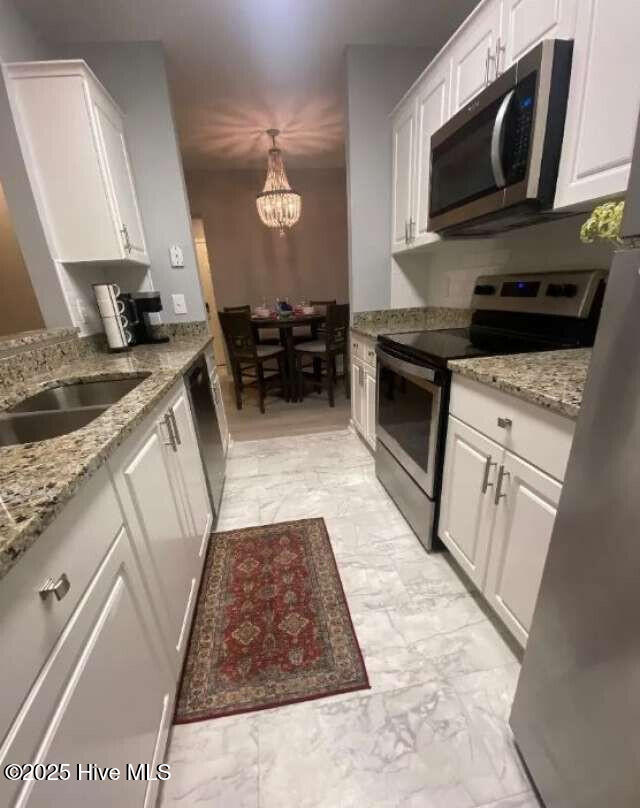 311 N 2nd St Unit B, Wilmington, NC 28401 - bathroom featuring toilet, tile patterned floors, and vanity