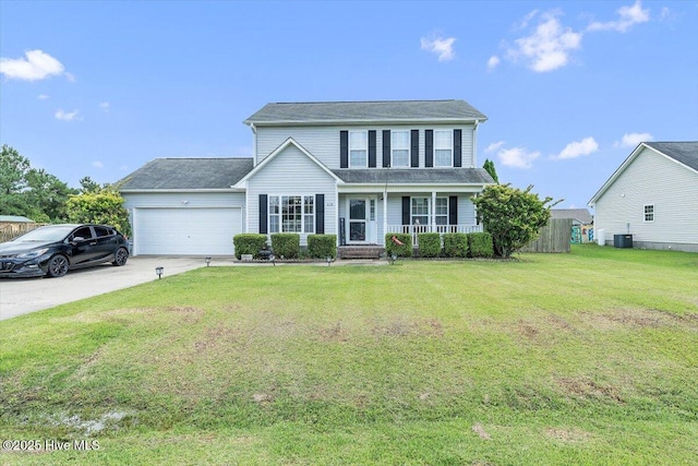 618 Godette School Rd, Havelock, NC 28532 - traditional home with an attached garage, concrete driveway, covered porch, and a front lawn
