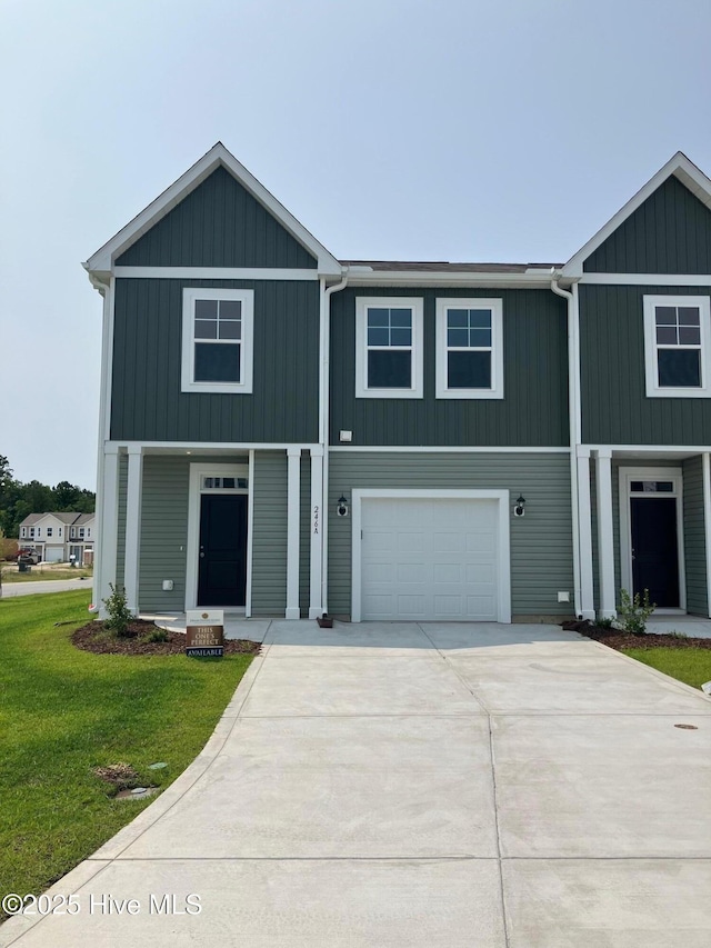 254 Arnette Dr Unit 82B, Shallotte, NC 28469 - view of front of property with a front lawn, concrete driveway, and an attached garage