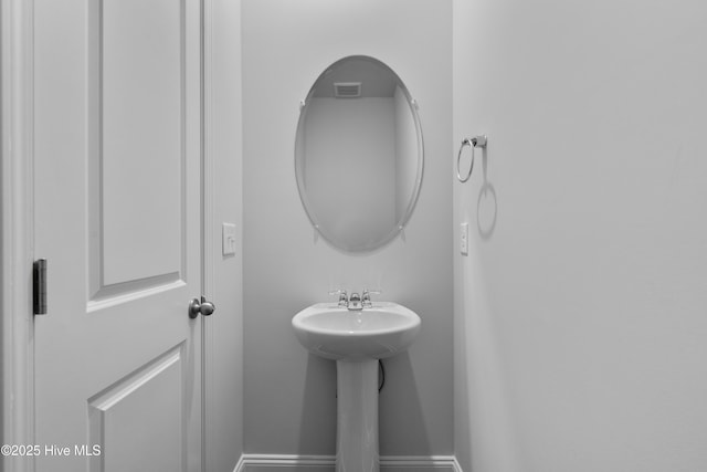 254 Arnette Dr Unit 82B, Shallotte, NC 28469 - bathroom with baseboards