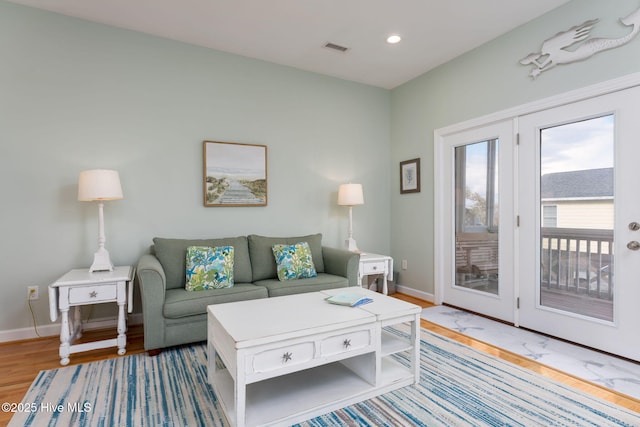 104 Sea Oaks Ct, North Topsail Beach, NC 28460 - living room with light wood-style flooring, baseboards, and recessed lighting