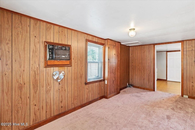 110 Texanna Ln, Raeford, NC 28376 - unfurnished bedroom featuring carpet floors, wood walls, baseboards, and a wall unit AC