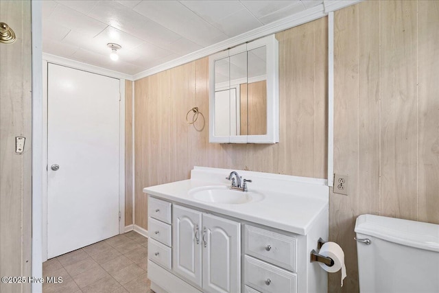 110 Texanna Ln, Raeford, NC 28376 - bathroom featuring vanity, toilet, tile patterned flooring, and wood walls