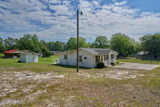 110 Texanna Ln, Raeford, NC 28376 - view of home's exterior with a patio area and view of wooded area
