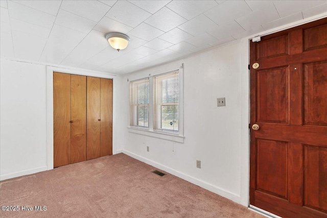 110 Texanna Ln, Raeford, NC 28376 - unfurnished bedroom featuring carpet floors, a closet, and baseboards