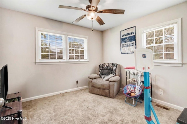 209 Bunche Dr, Goldsboro, NC 27530 - living area with baseboards, a ceiling fan, and carpet