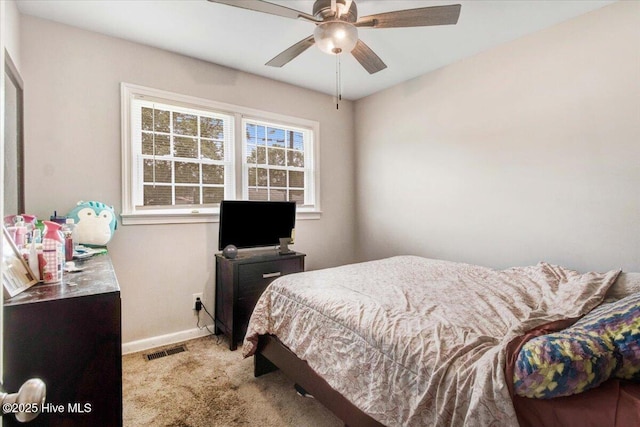 209 Bunche Dr, Goldsboro, NC 27530 - bedroom with baseboards, carpet flooring, and a ceiling fan