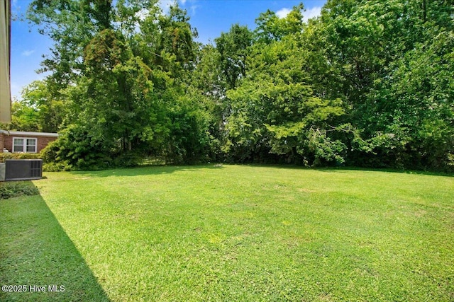 209 Bunche Dr, Goldsboro, NC 27530 - view of grassy yard featuring central air condition unit