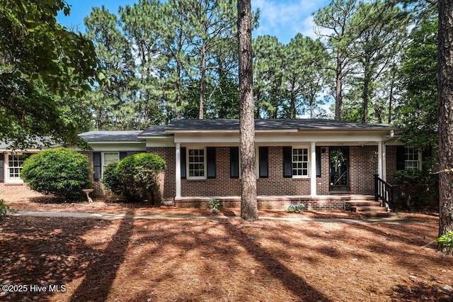 1809 E Indiana Ave, Southern Pines, NC 28387 - ranch-style home with brick siding and covered porch
