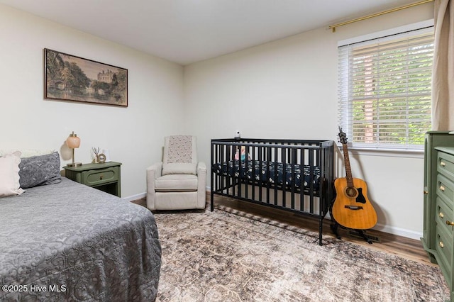 1809 E Indiana Ave, Southern Pines, NC 28387 - bedroom featuring baseboards and wood finished floors