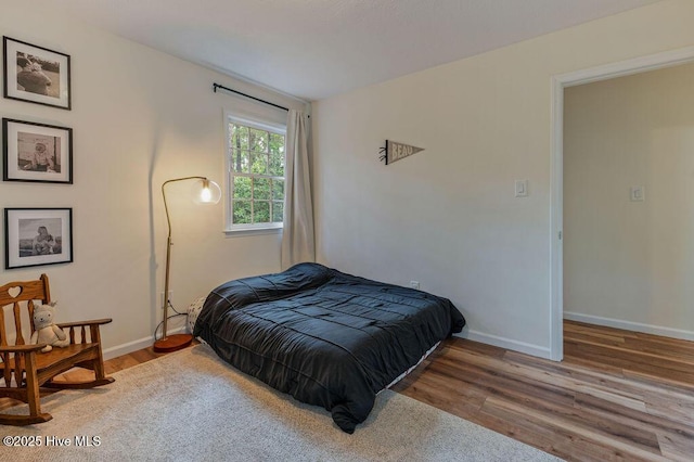 1809 E Indiana Ave, Southern Pines, NC 28387 - bedroom with wood finished floors and baseboards