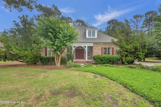 423 White Columns Way, Wilmington, NC 28411 - view of front of home with a front lawn, brick siding, and a shingled roof