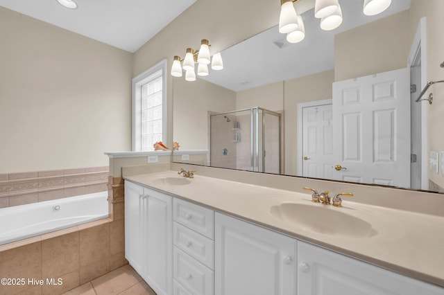 423 White Columns Way, Wilmington, NC 28411 - full bath with double vanity, a shower stall, tile patterned flooring, and a garden tub