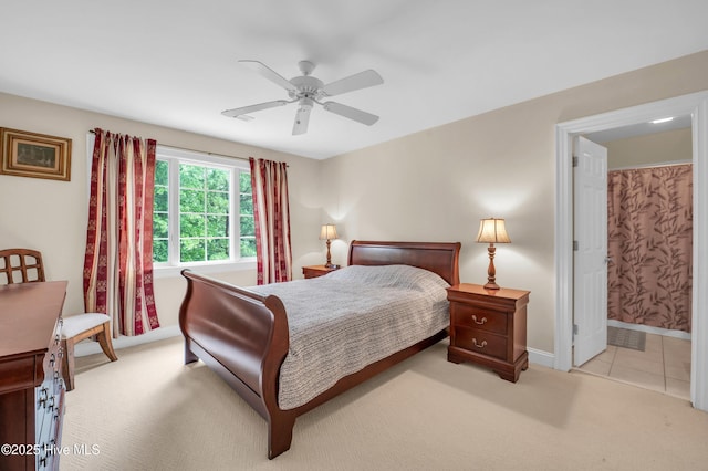423 White Columns Way, Wilmington, NC 28411 - bedroom with carpet, baseboards, ensuite bath, and a ceiling fan