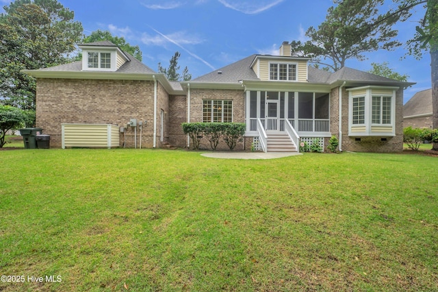 423 White Columns Way, Wilmington, NC 28411 - rear view of property with a sunroom, a patio area, a lawn, crawl space, and brick siding