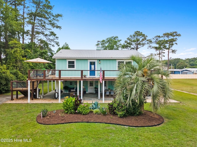 2767 Nags Head Rd SW, Supply, NC 28462 - back of house with a deck, a patio, a yard, metal roof, and stairway