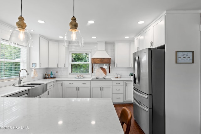 2767 Nags Head Rd SW, Supply, NC 28462 - kitchen featuring stainless steel fridge, a sink, custom range hood, plenty of natural light, and recessed lighting