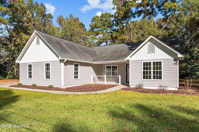 106 Waterside Dr, Bath, NC 27808 - view of front of home with a porch, a front yard, and a shingled roof