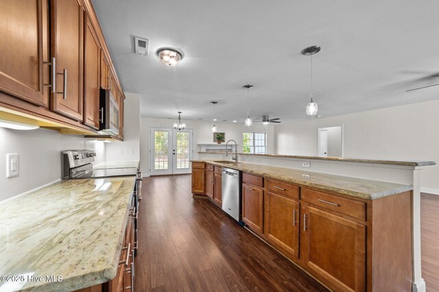 106 Waterside Dr, Bath, NC 27808 - kitchen featuring french doors, a sink, stainless steel appliances, brown cabinetry, and dark wood finished floors