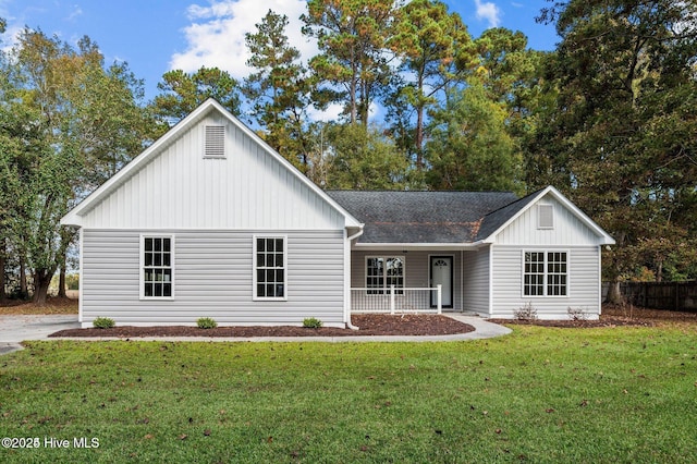 106 Waterside Dr, Bath, NC 27808 - view of front of property featuring a front lawn, a porch, a shingled roof, and board and batten siding