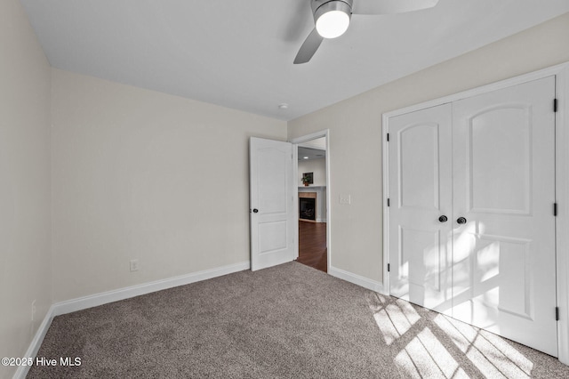 106 Waterside Dr, Bath, NC 27808 - unfurnished bedroom featuring carpet floors, baseboards, a closet, and ceiling fan