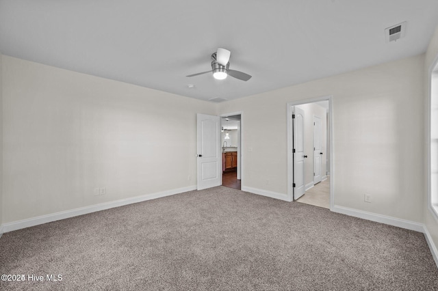 106 Waterside Dr, Bath, NC 27808 - unfurnished bedroom with light carpet, baseboards, ensuite bath, and ceiling fan