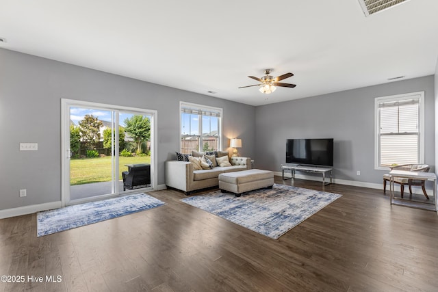 737 Heartwood Dr, Leland, NC 28479 - living room featuring healthy amount of natural light, a ceiling fan, wood finished floors, and baseboards
