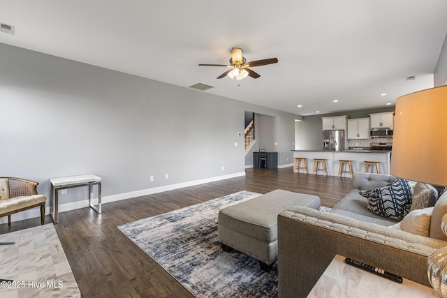 737 Heartwood Dr, Leland, NC 28479 - living room featuring a ceiling fan, baseboards, recessed lighting, wood finished floors, and stairs