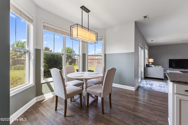 737 Heartwood Dr, Leland, NC 28479 - dining room with dark wood-style flooring and baseboards