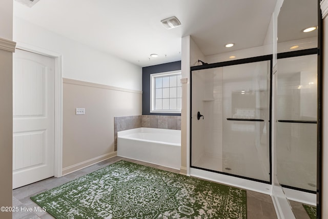 737 Heartwood Dr, Leland, NC 28479 - bathroom featuring a garden tub, tile patterned floors, a stall shower, recessed lighting, and baseboards
