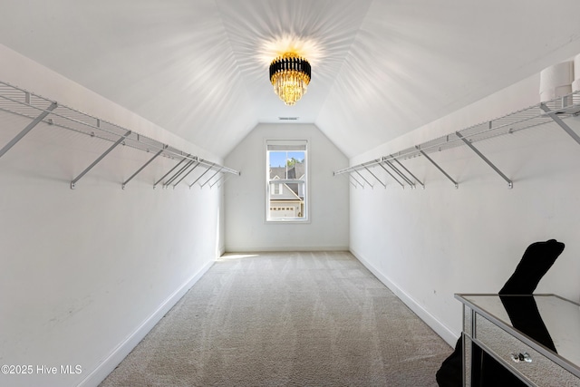 737 Heartwood Dr, Leland, NC 28479 - walk in closet featuring lofted ceiling and carpet flooring
