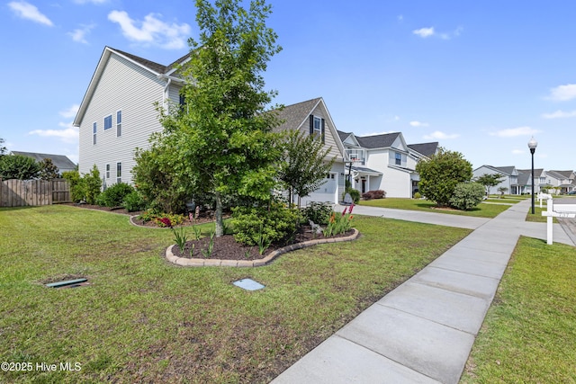 737 Heartwood Dr, Leland, NC 28479 - view of property exterior with an attached garage, a residential view, and driveway