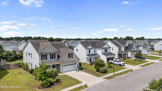 737 Heartwood Dr, Leland, NC 28479 - view of front of house with a residential view, a garage, and driveway