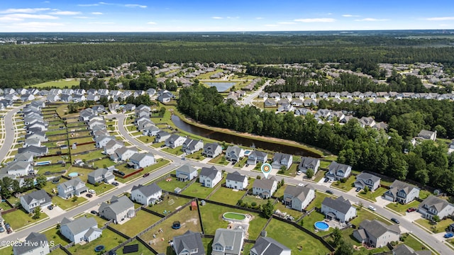 737 Heartwood Dr, Leland, NC 28479 - aerial view of property and surrounding area with a heavily wooded area and nearby suburban area