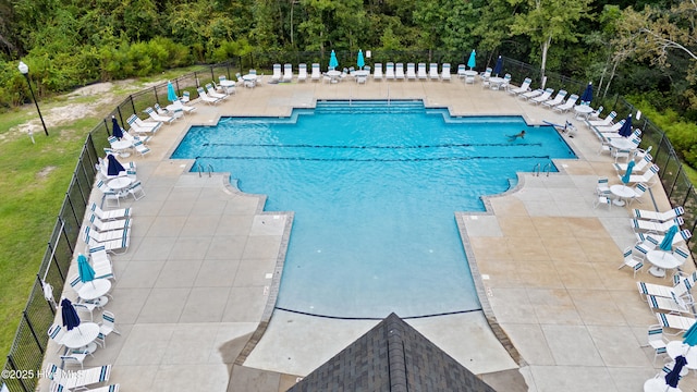 737 Heartwood Dr, Leland, NC 28479 - community pool featuring a patio area and a view of trees