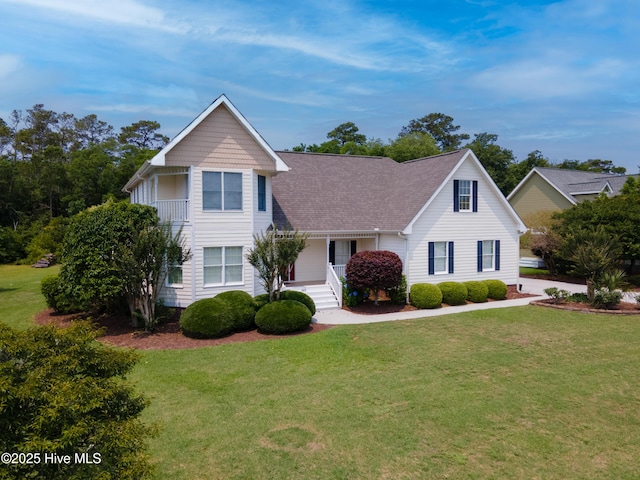 142 Magens Way, Cedar Point, NC 28584 - traditional-style home with a front lawn and a shingled roof