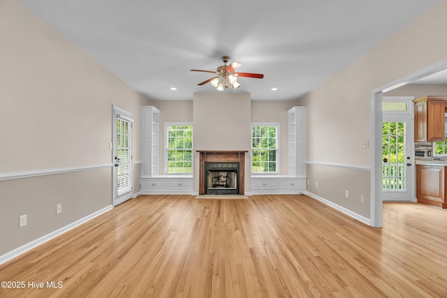 142 Magens Way, Cedar Point, NC 28584 - unfurnished living room featuring ceiling fan, light wood finished floors, a fireplace with flush hearth, baseboards, and recessed lighting