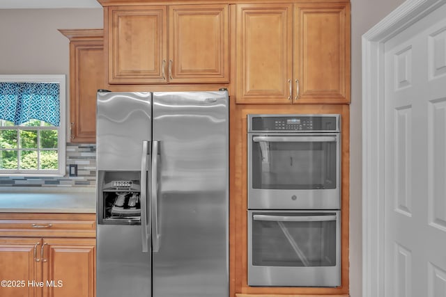 142 Magens Way, Cedar Point, NC 28584 - kitchen with appliances with stainless steel finishes, tasteful backsplash, light countertops, and brown cabinets