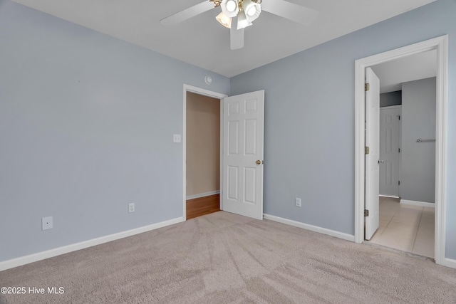142 Magens Way, Cedar Point, NC 28584 - unfurnished bedroom featuring carpet, baseboards, and a ceiling fan