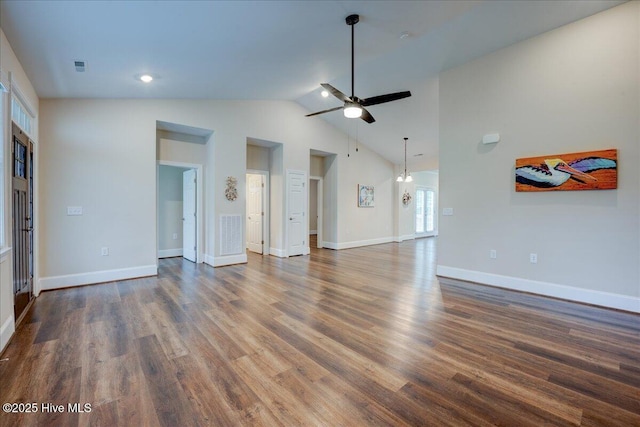 409 Kinnakeet Ln, New Bern, NC 28562 - unfurnished living room featuring a ceiling fan, dark wood-style flooring, vaulted ceiling, and baseboards