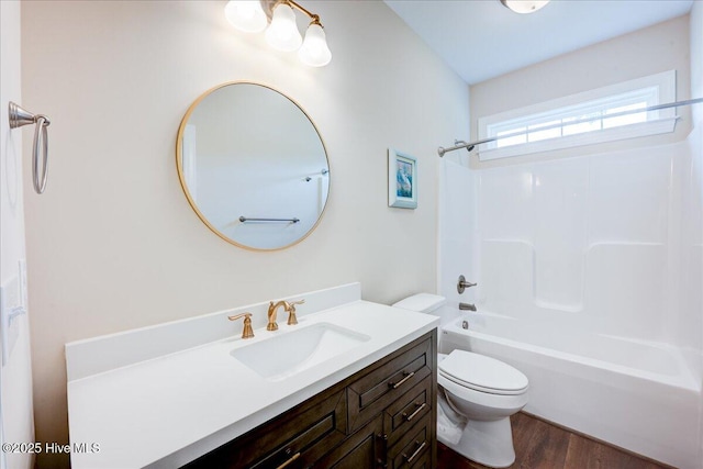 409 Kinnakeet Ln, New Bern, NC 28562 - bathroom with toilet, vanity,  shower combination, and wood finished floors