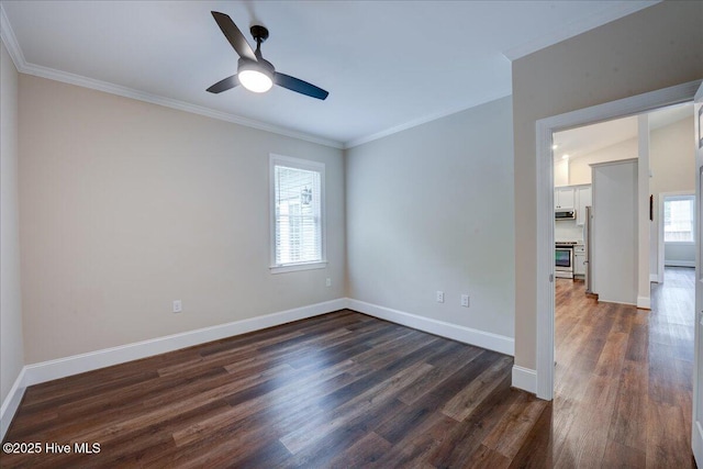 409 Kinnakeet Ln, New Bern, NC 28562 - unfurnished room featuring ornamental molding, dark wood-style flooring, baseboards, and ceiling fan