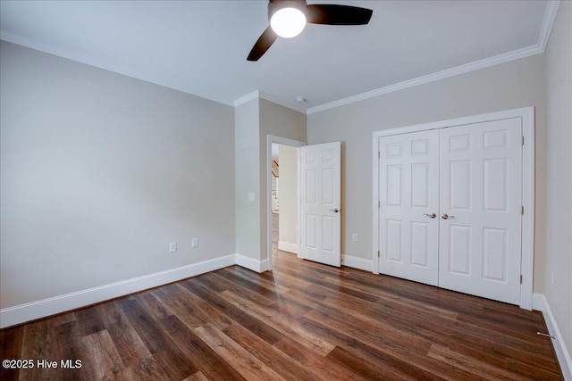 409 Kinnakeet Ln, New Bern, NC 28562 - unfurnished bedroom featuring dark wood finished floors, ornamental molding, baseboards, a closet, and a ceiling fan