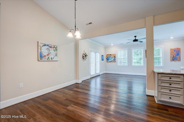 409 Kinnakeet Ln, New Bern, NC 28562 - unfurnished living room with dark wood finished floors, ceiling fan, baseboards, ornamental molding, and a chandelier