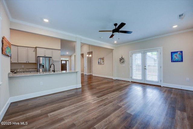 409 Kinnakeet Ln, New Bern, NC 28562 - unfurnished living room featuring dark wood-style floors, a ceiling fan, baseboards, crown molding, and recessed lighting