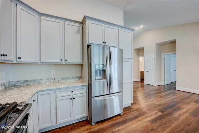 409 Kinnakeet Ln, New Bern, NC 28562 - kitchen with stainless steel refrigerator with ice dispenser, range, dark wood-style flooring, light stone counters, and baseboards