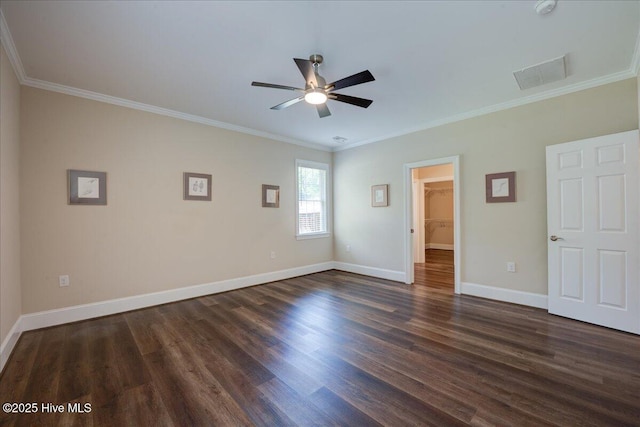 409 Kinnakeet Ln, New Bern, NC 28562 - unfurnished bedroom featuring crown molding, dark wood-style floors, baseboards, a spacious closet, and a ceiling fan